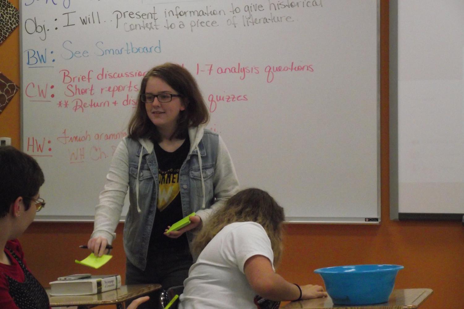 Senior Katie Mabry leads a creative writing club meeting in room 117. The club is currently preparing for National Novel Writing Month.