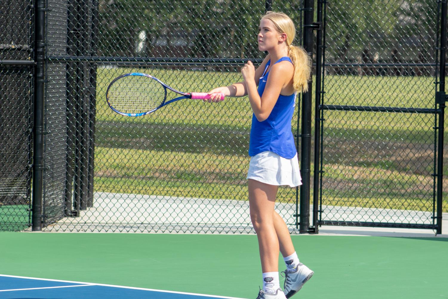 Senior Kate Ferguson returns the ball in a match against Fayetteville early in the season. The Wampus Cat Tennis team was successful in their conference matches this month.