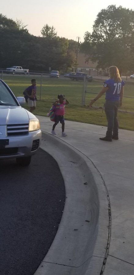 Football Seniors Greet Elementary Schools