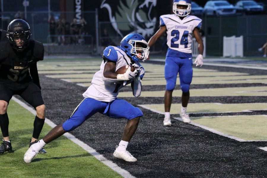 Manny Smith, 12 scores a touchdown for Conway. The Wampus Cats beat the Bentonville Tigers 55-41 the night of that game. “I scored 2 touchdowns and ran for about 110 yards. It was exciting to beat Bentonville because we haven’t beat them in 5 years. My goals for this year are to win state and bond better with my team,” Smith said.