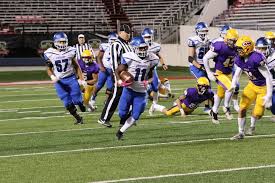 Boogie Carr carries the ball against Catholic.