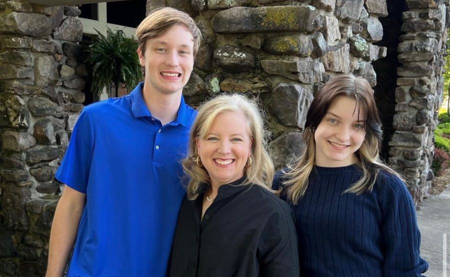 Juniors Matthew and Mary Caroline Grimes pose with their mother Laura. 