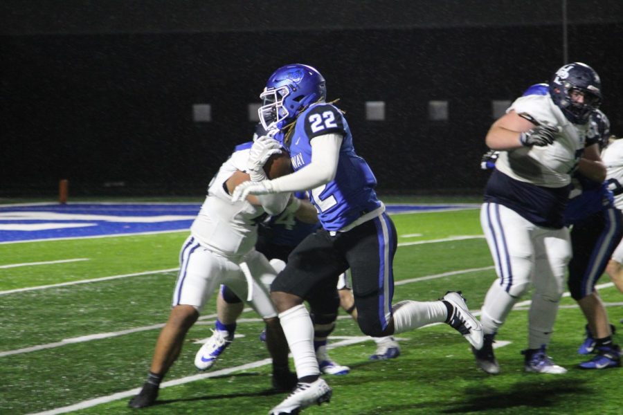 Junior Desmond Davidson runs the ball to the endzone against Har-Ber November 11 in the first round of the 7A playoffs. 