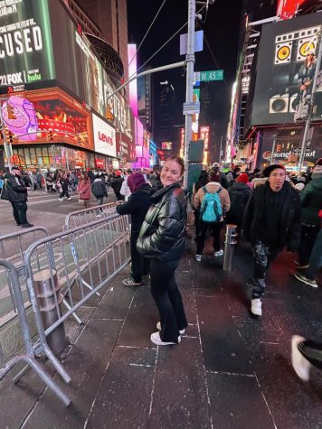This photo features Junior Ellie Matthews in NYC at times square for New Years Eve. 