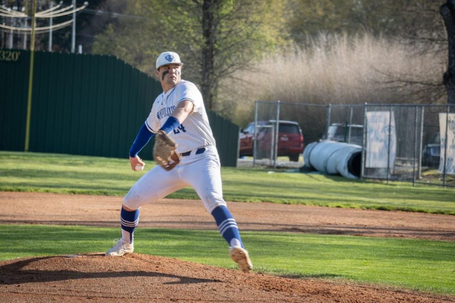 Preston Prock delivers a pitch to a Cabot hitter