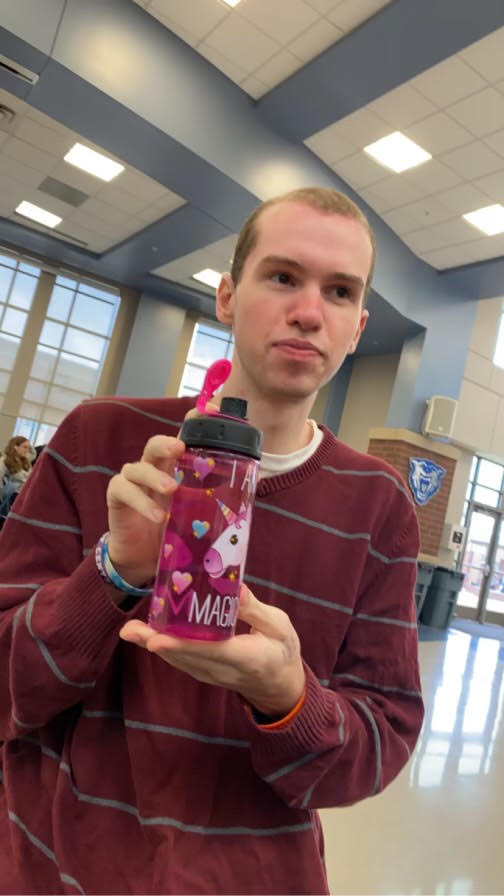 Owen Starnes holding up his, I am magical cup. 