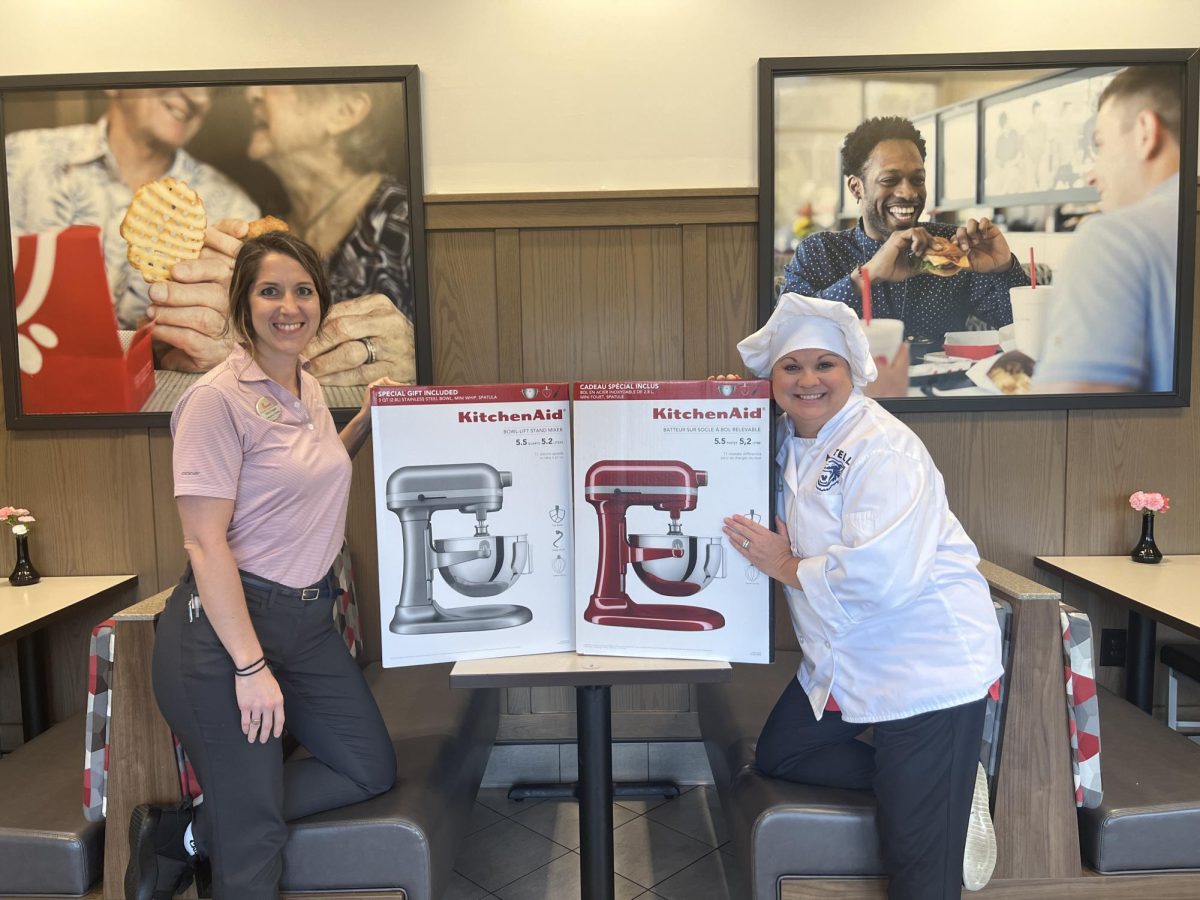 CHS Culinary teacher, Leslee Tell poses with the mixers donated by Chick-Fil-A of West Conway. 