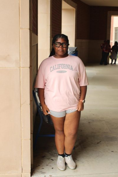 Junior Brooklyn Butler poses at a photography workshop.  She attended as part of her journalism coursework, which ties directly to her future goals. 