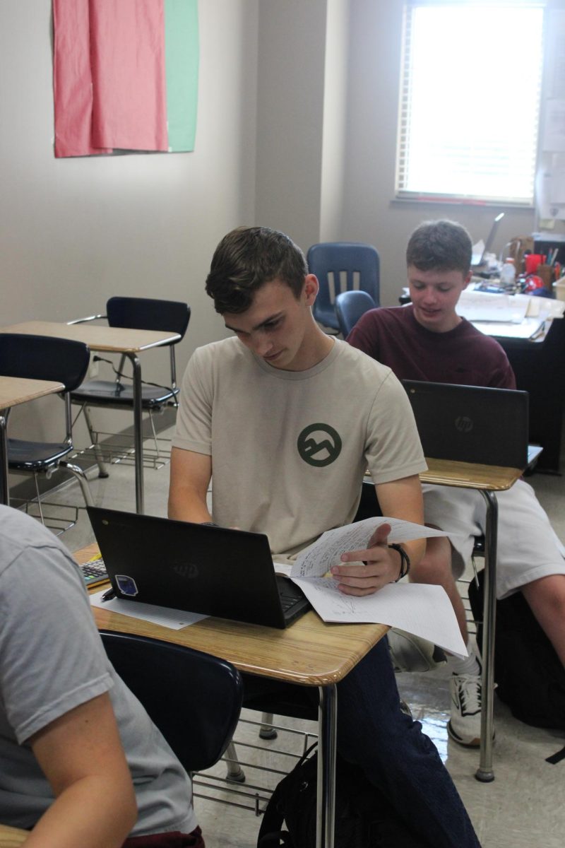 Ransom Fassett working in math class. 