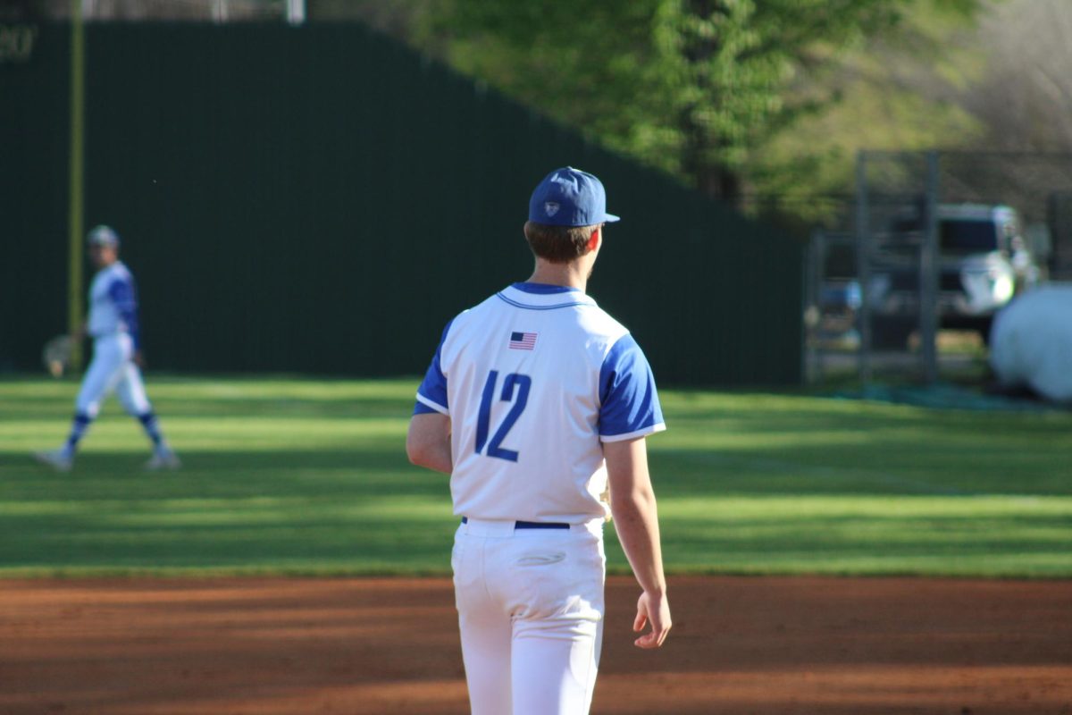 Wesley Tapp on the pitching mound during warm ups in a game last season.